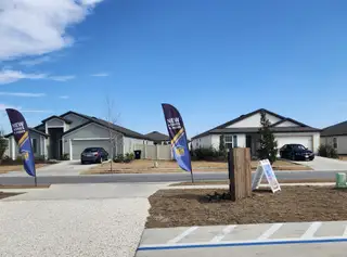 Charming new homes with manicured lawns in Rolling Hills by LGI Homes (Green Cove Springs, FL).