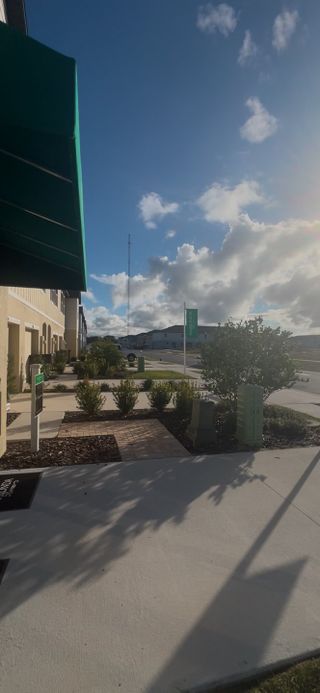 Modern community with landscaped pathways and welcoming entry in Oak Creek Preserve by Maronda Homes (Lakeland, FL).