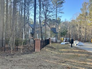 A charming home nestled in wooded surroundings in Watkins Glen by Exeter Building Company (Wake Forest, NC).