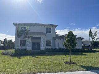 Street view A modern two-story home with a landscaped front yard in Silverland Estates by Lennar (Miami, FL).