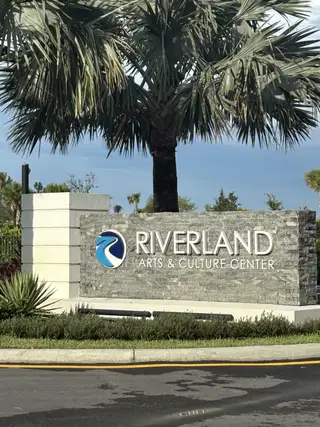 Street view Welcome to Valencia Walk at Riverland by GL Homes, featuring the Riverland Arts & Culture Center in Port St. Lucie, FL.
