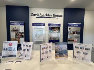 An informative homebuyer resource center displaying benefits of new construction in Solterra by David Weekley Homes (Mesquite, TX).