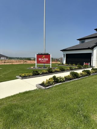 A modern home with lush landscaping and a sleek design in Montgomery Ridge: Founders Collection by Beazer Homes (Montgomery, TX).