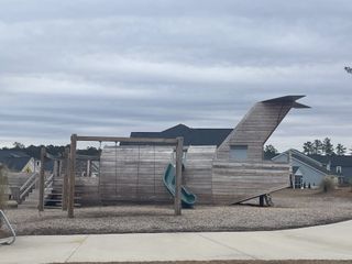 A creative playground shaped like an airplane in Waterside at Lakes of Cane Bay: Arbor Collection by Lennar (Summerville, SC).