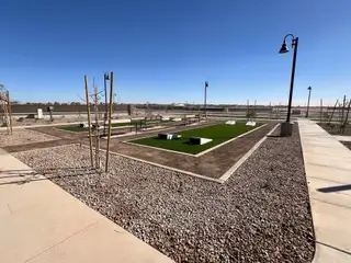 A landscaped community park with modern features in Rancho Mirage Signature Series by Meritage Homes (Maricopa, AZ).