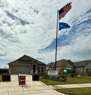 Street view A charming home with a landscaped yard in Lago Mar by Lennar in Texas City, TX.