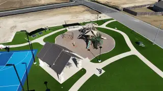 Community Amenities A vibrant community park with playground and sports court at Cielo Gardens: Welton Collection by Lennar (Jarrell, TX).