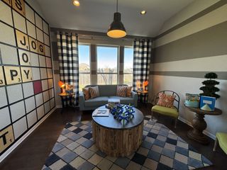 A playful game room with a giant Scrabble wall, checkered curtains, and cozy seating for family fun and creativity.