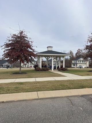 Charming gazebo and trees in the Sanders Ridge community by M/I Homes, nestled in Troutman, NC.