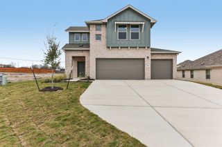 New construction  house 319 Dogvane Cir, Kyle, TX 78640 plan Conchos - 3 Car - image